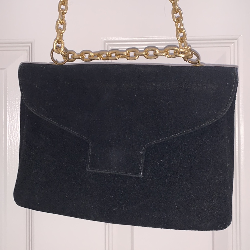 Black suede handbag with gold clasp and chain.  Good condition.